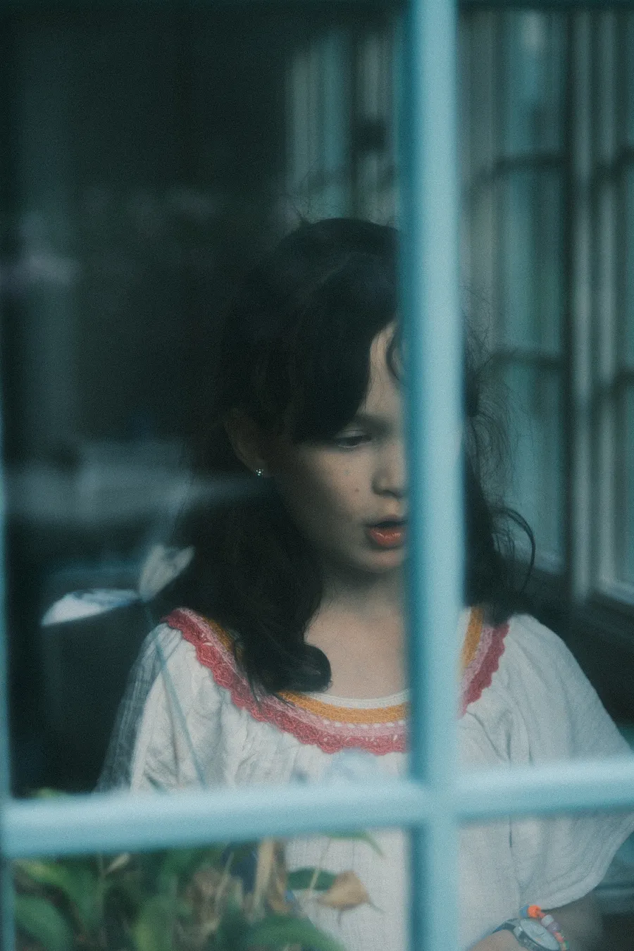 Portrait through glass.